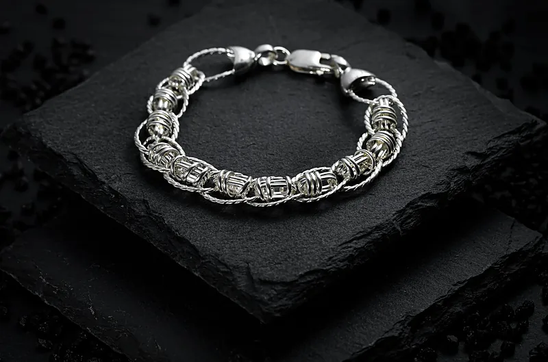 Silver chain bracelet on black slate